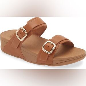 Tan Fit flops with gold tone buckles size 10
